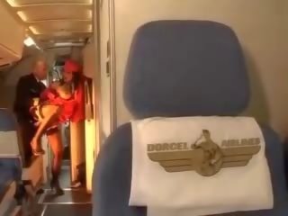 Desiring stewardess rides a manhood inside both holes