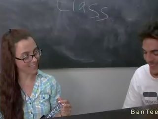 Busty teacher helps couple in handjob in classroom